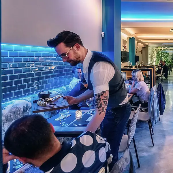 James serving at his restaurant